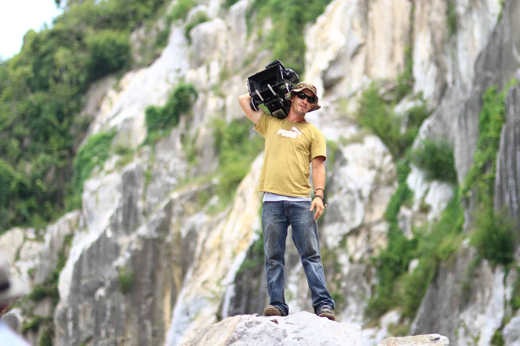 camera man standing on cliff